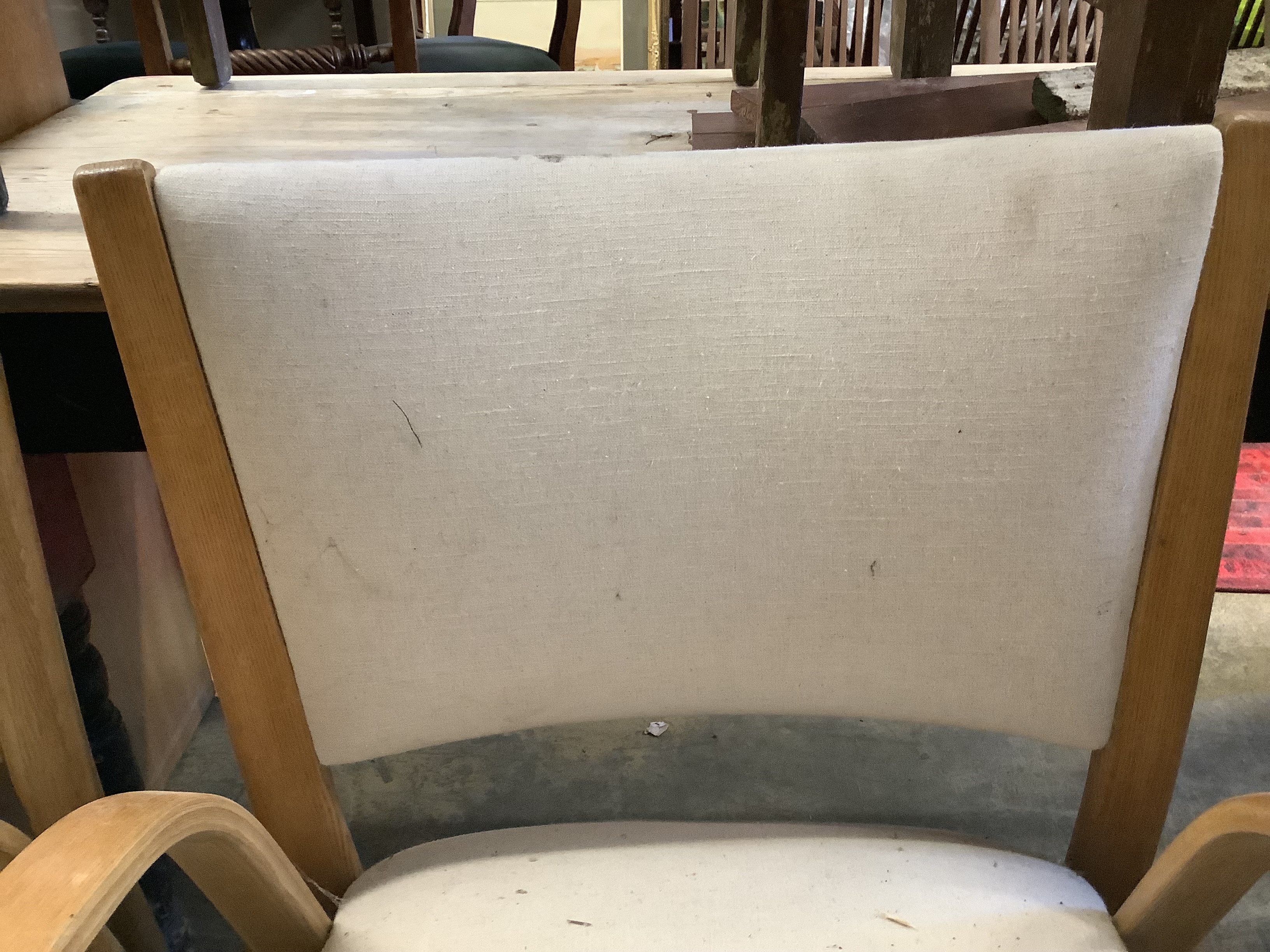 A pair of mid century elbow chairs